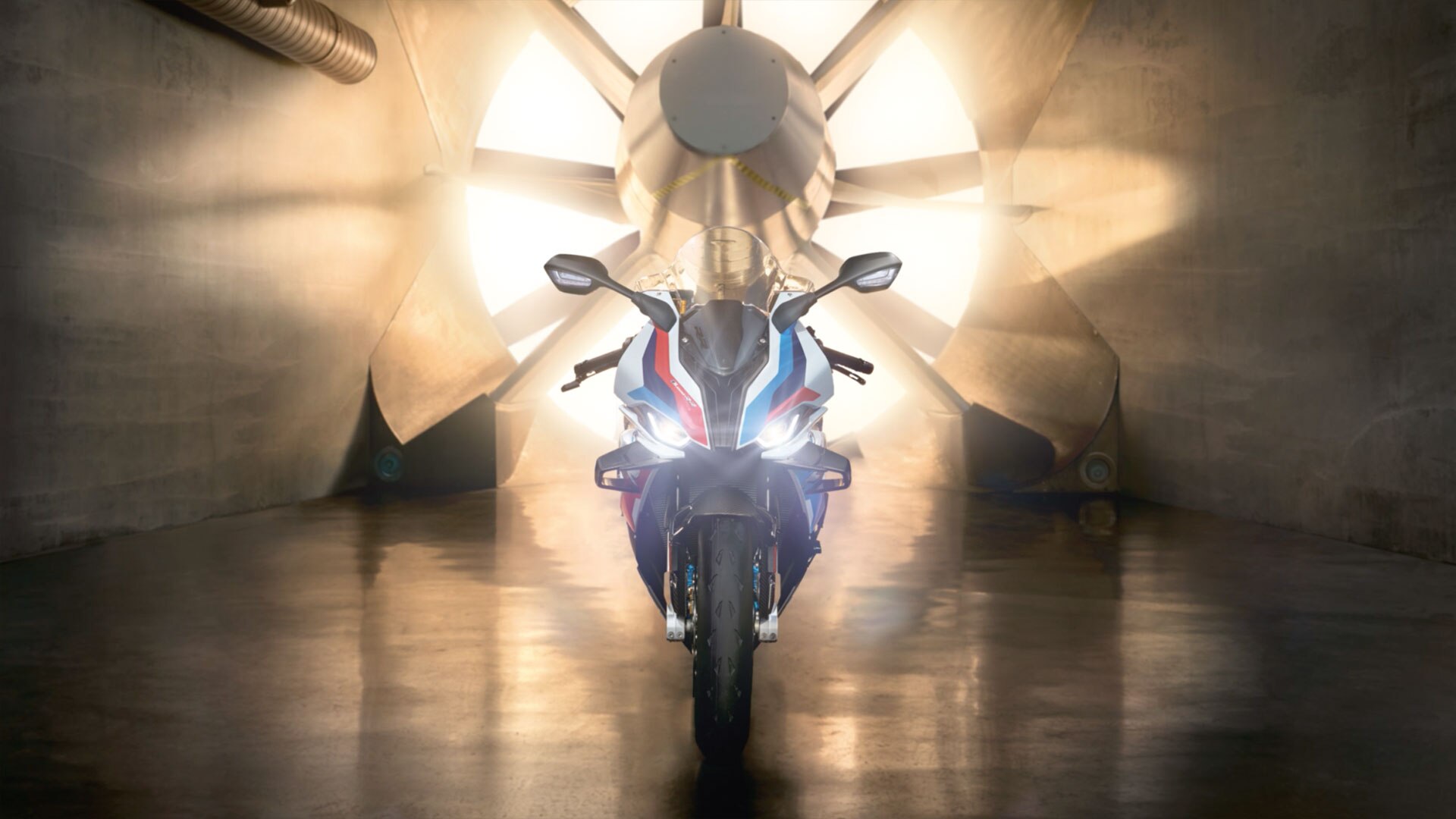 We see the M RR in front of a rotating turbine when the sun is shining.
